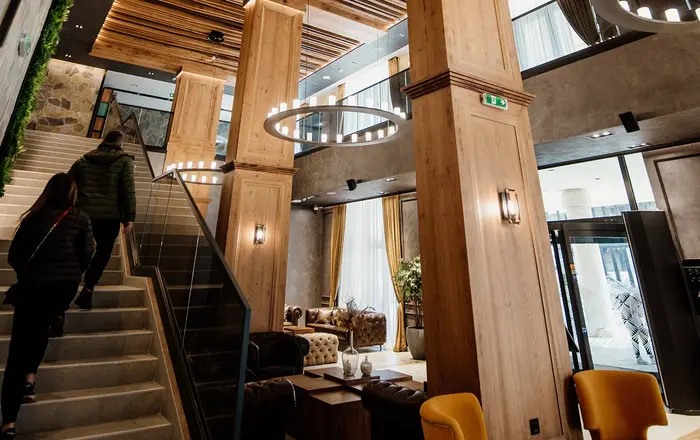 Modern interior design of a chic café showcasing wooden accents and spacious layout