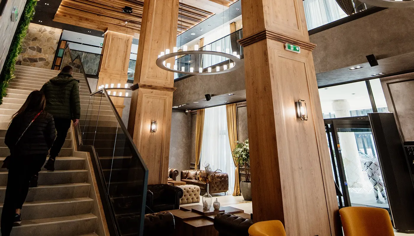 Modern interior design of a chic café showcasing wooden accents and spacious layout